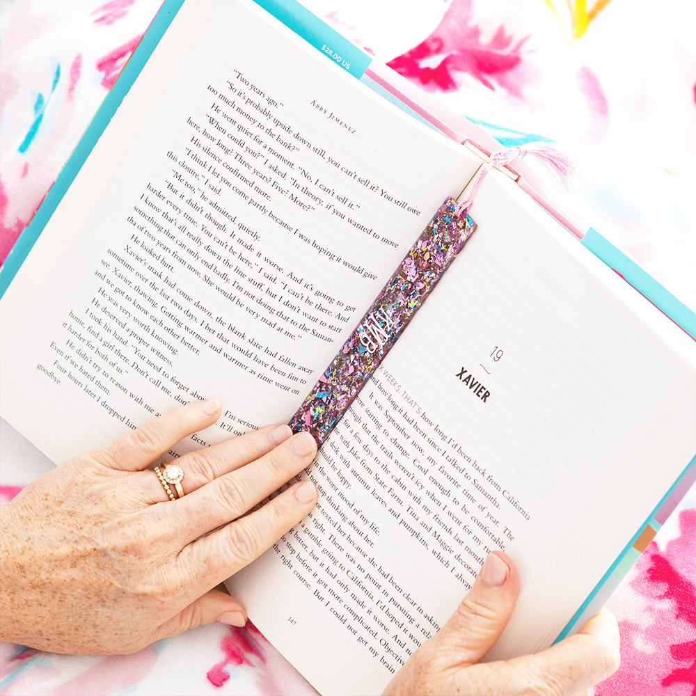 pink glitter bookmark in book
