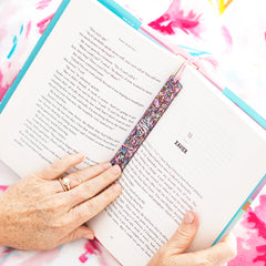 pink glitter bookmark in book