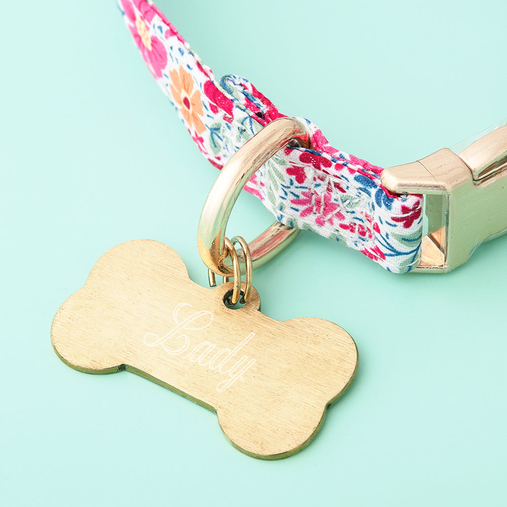 gold dog tag up close