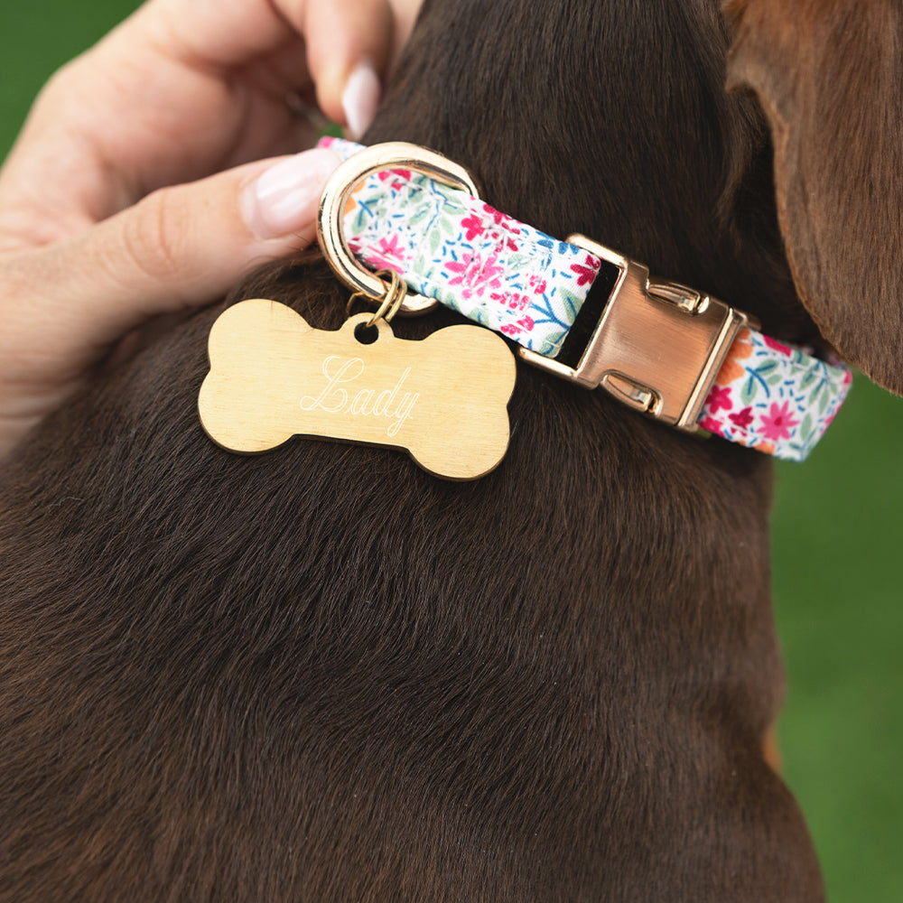 gold dog tag with flower collar