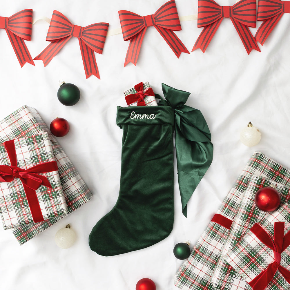 green bow stocking flatlay