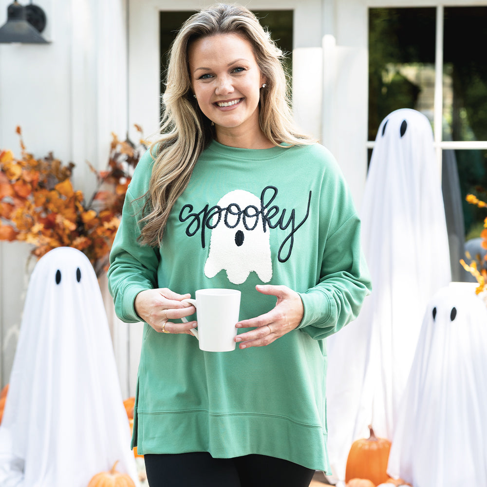 green spooky sweatshirt on emily