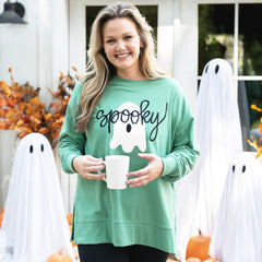 green spooky sweatshirt on emily