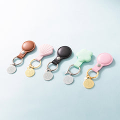 group shot of 5 airtag keychains