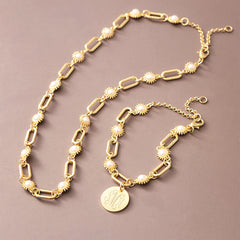 gold pearl starburst necklace with bracelet