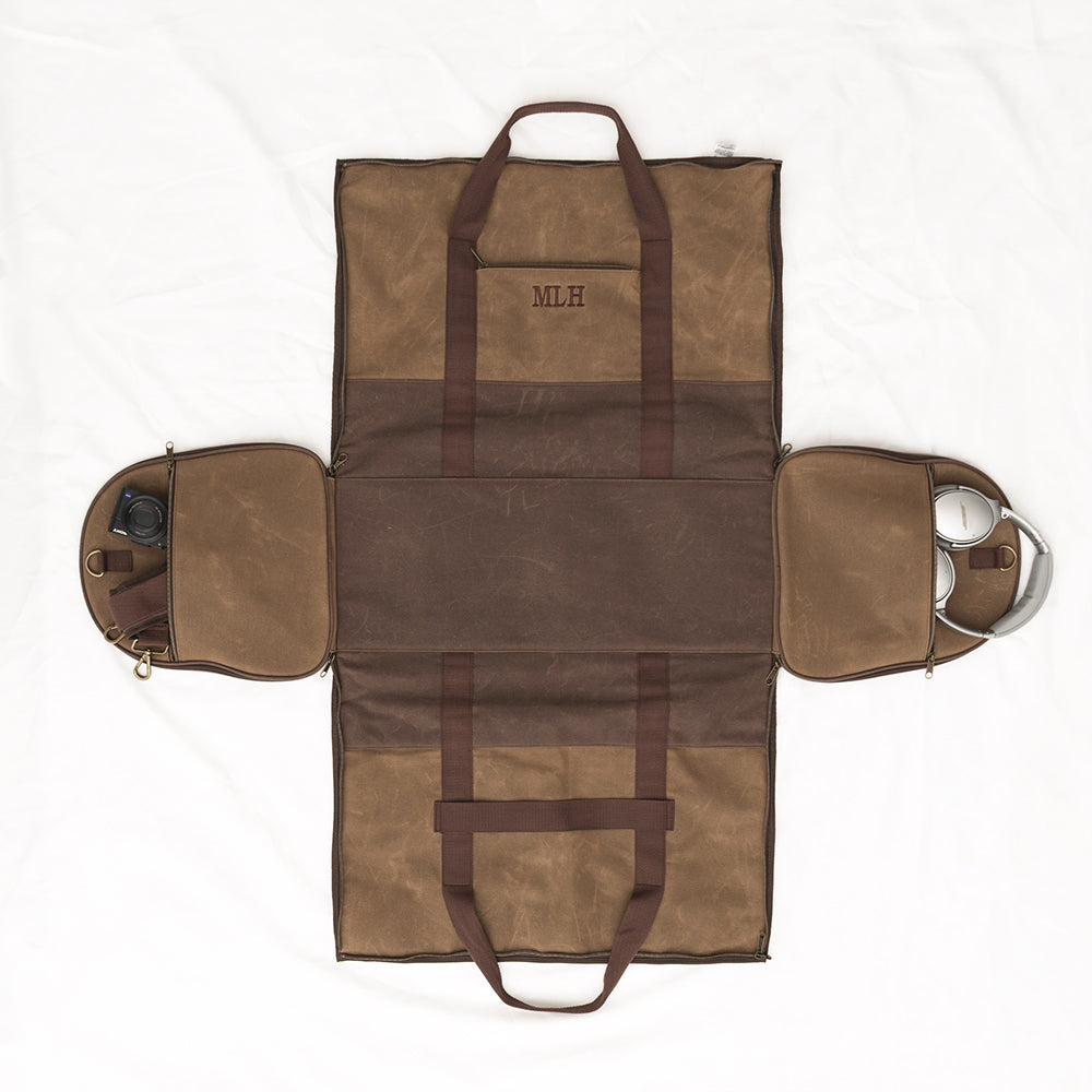 waxed canvas convertible weekend bag flatlay