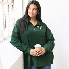 girl wearing pine monogrammed waffle knit pullover with jeans