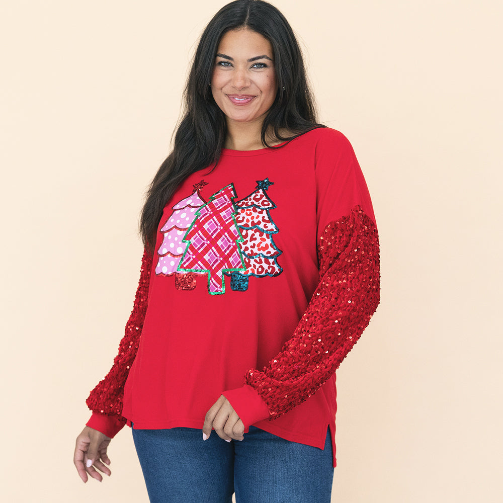 girl wearing red christmas sweatshirt