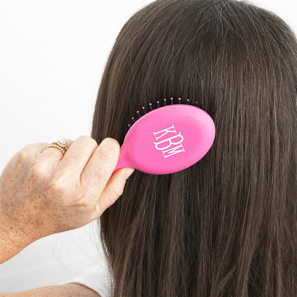 hot pink purse hairbrush in hair