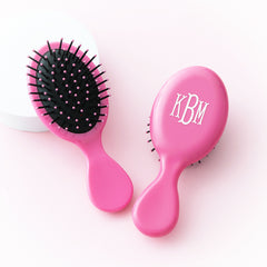 hot pink purse hairbrush studio shot