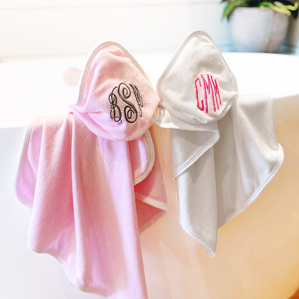 baby hooded towels on bath tub