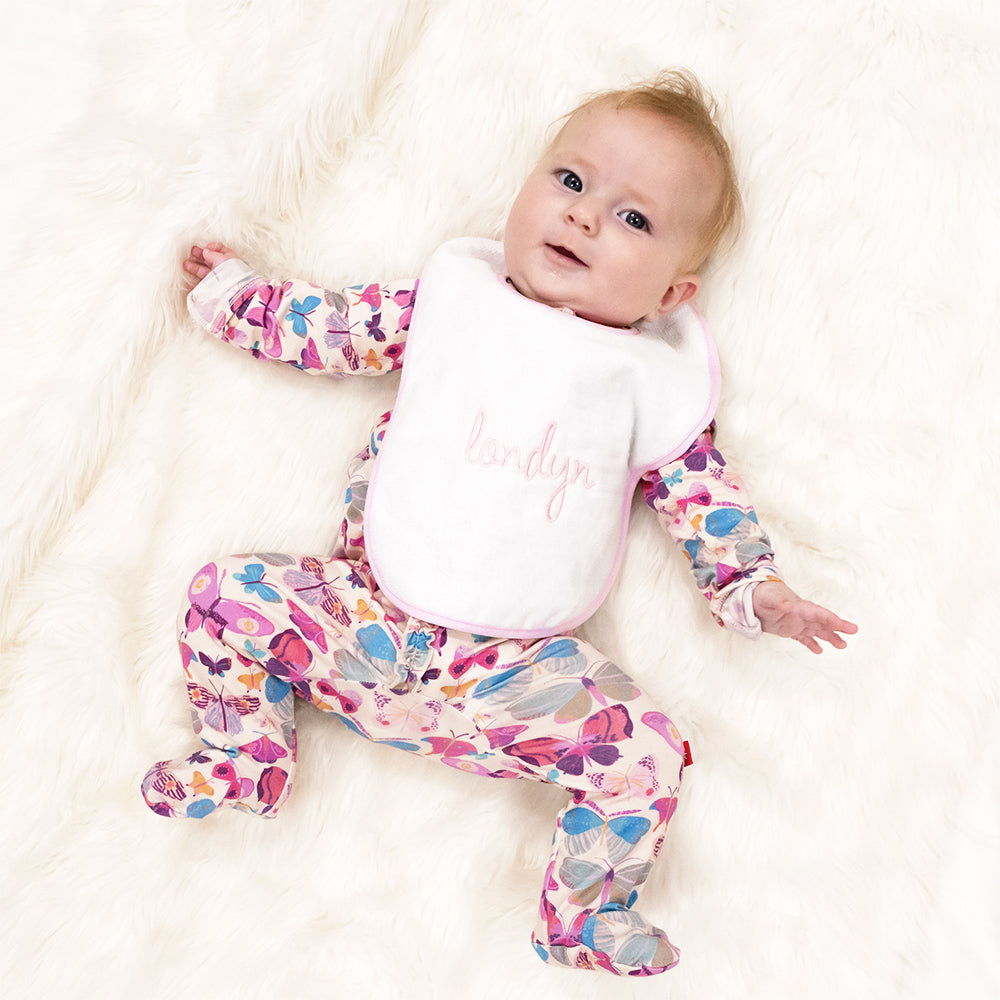 pink outline baby bib on baby