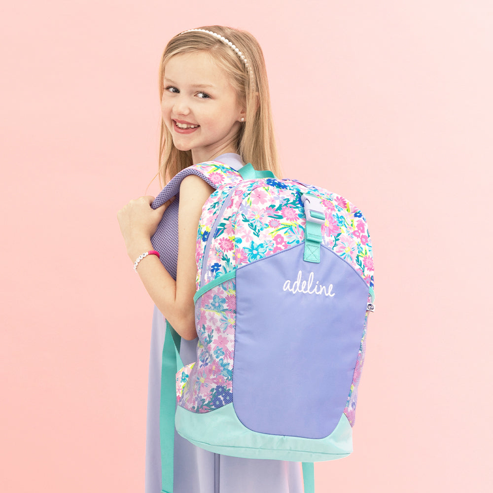 mint oopsie daisy backpack on addie