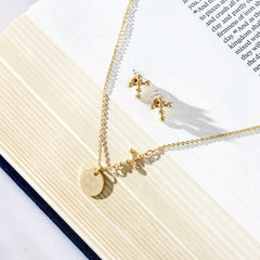 gold necklace set in bible