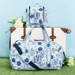 indigo painted petals monogrammed quilted weekender and hanging toiletry bag and luggage 
