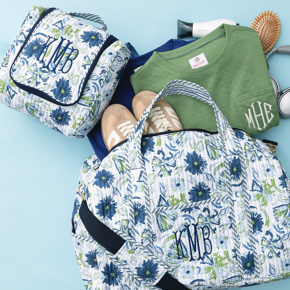 indigo painted petals monogrammed quilted weekender and hanging toiletry bag 