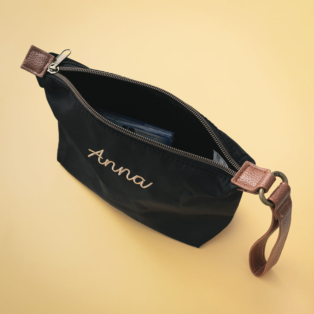 inside of black monogrammed lightweight wristlet 