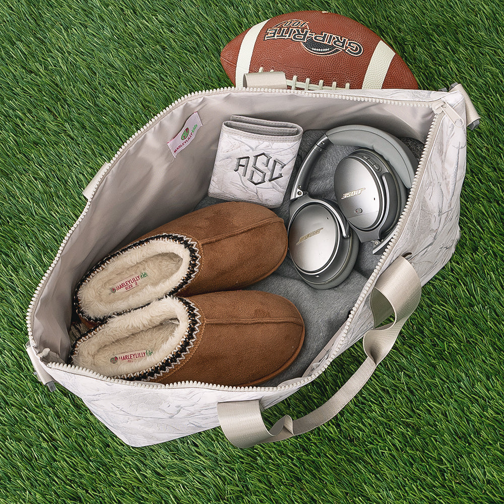 inside of personalized kids weekend bag in birch camo