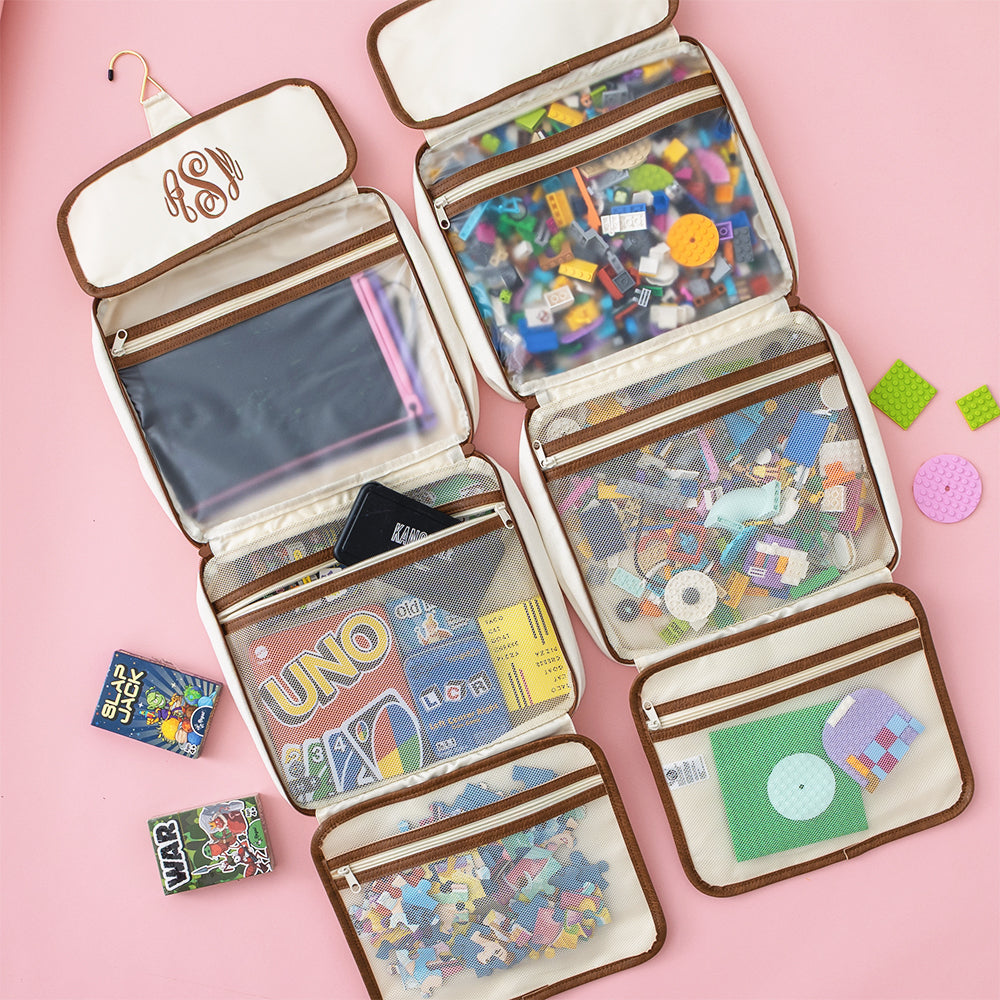 ivory hanging organizer flatlay with games