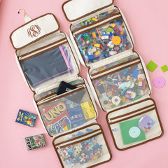 ivory hanging organizer flatlay with games