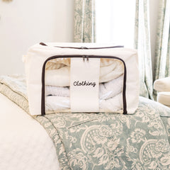 ivory monogrammed storage bag on bed 