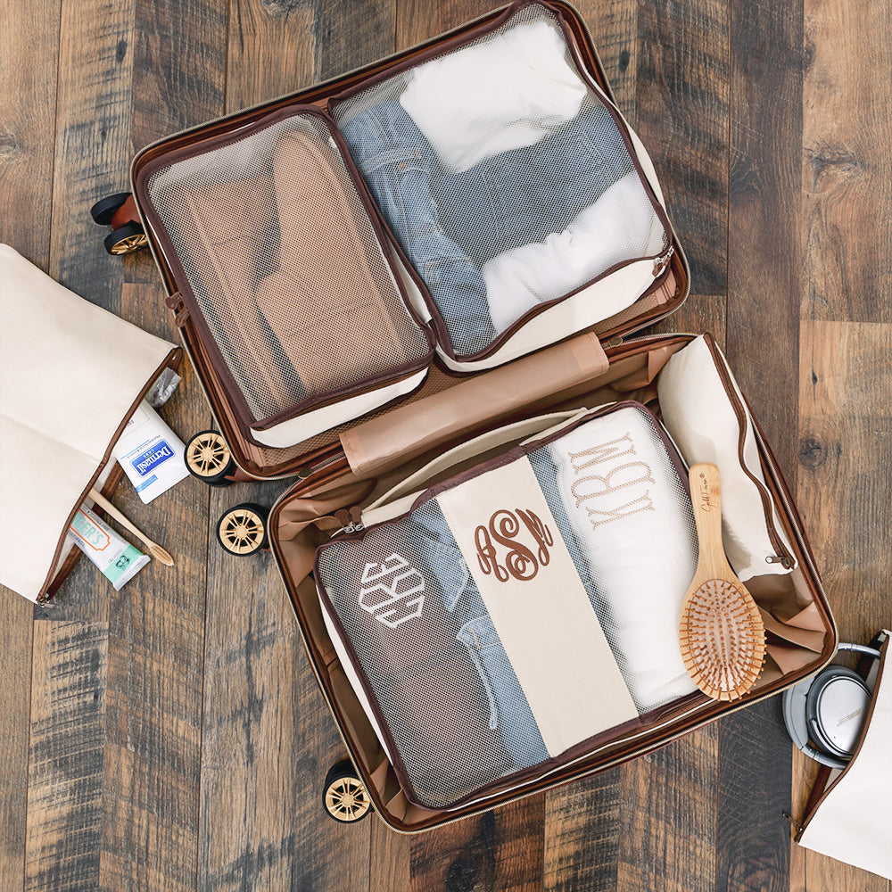 ivory monogrammed packing bag set in luggage 