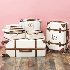 ivory monogrammed packing bag set on luggage 