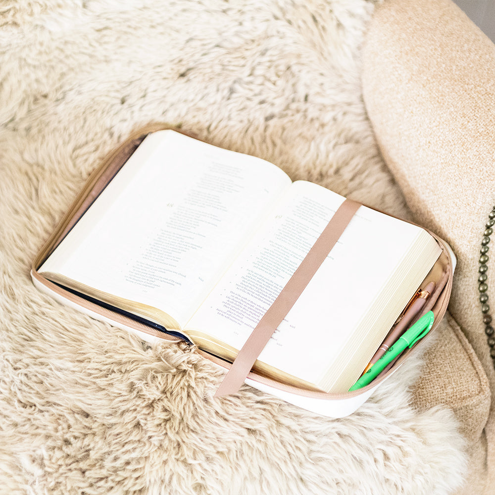 ivory tan bible carrier on blanket with highlighter