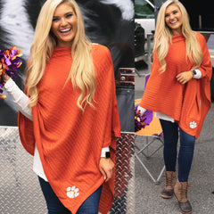 clemson orange poncho on blonde holding pom poms