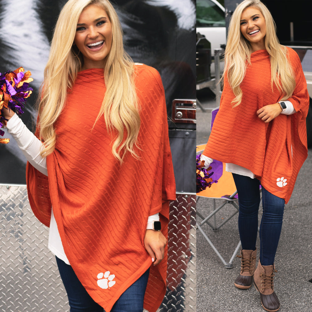 clemson orange poncho on blonde holding pom poms