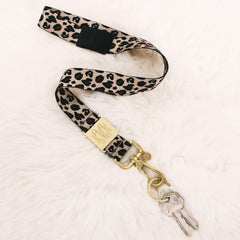 leopard breakaway lanyard on fuzzy rug