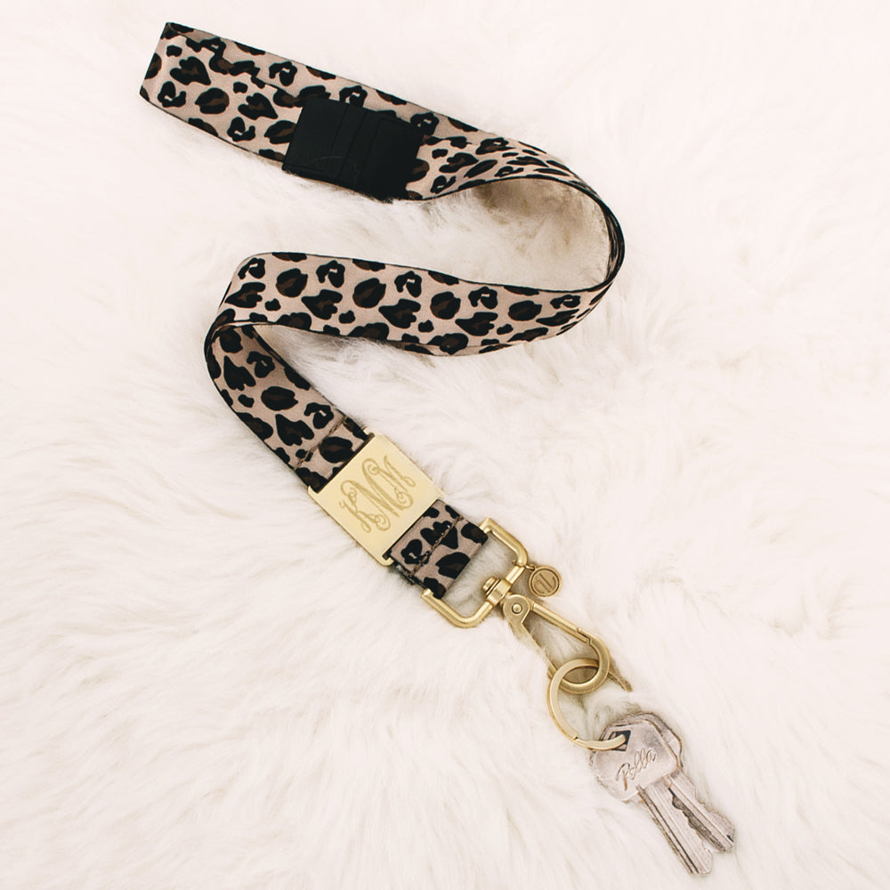 leopard breakaway lanyard on fuzzy rug