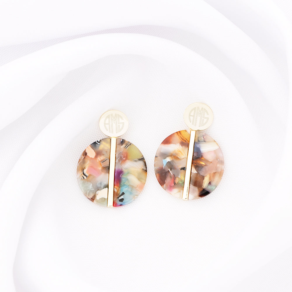 multi resin earrings on white cloth