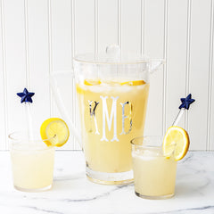 Clear acrylic pitcher with cups and star spoons