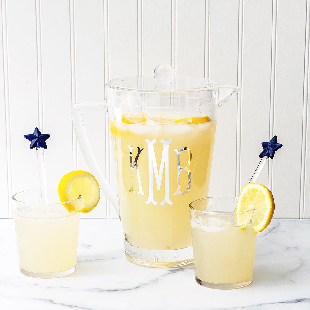 Clear acrylic pitcher with cups and star spoons