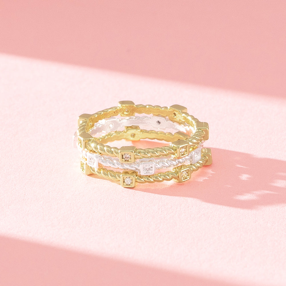 close up of silver and gold cable stack ring