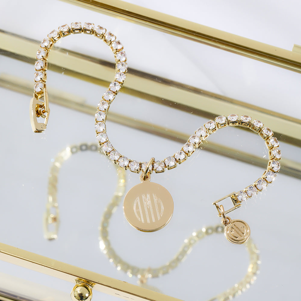 gold tennis bracelet reflected on mirror