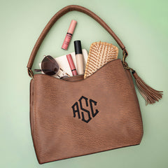camel brown cheyenne purse flatlay