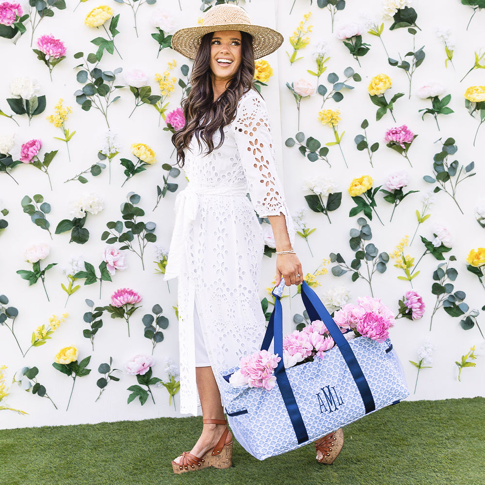 girl carrying personalized wire top extra large tote in blue shells