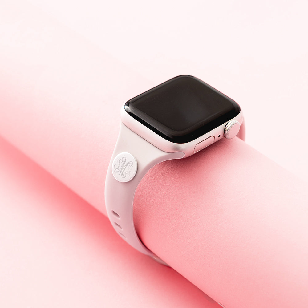 taupe watch band on pink background