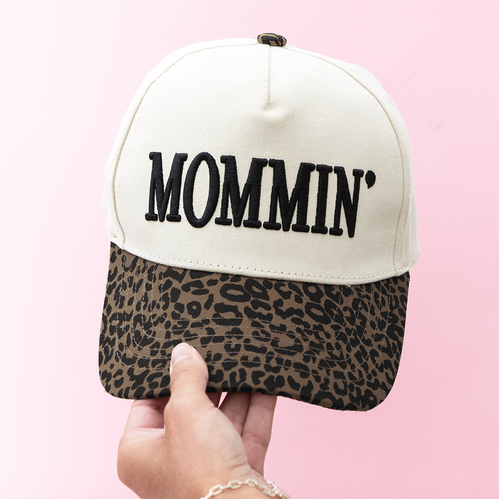 leopard mom trucker hat in hand
