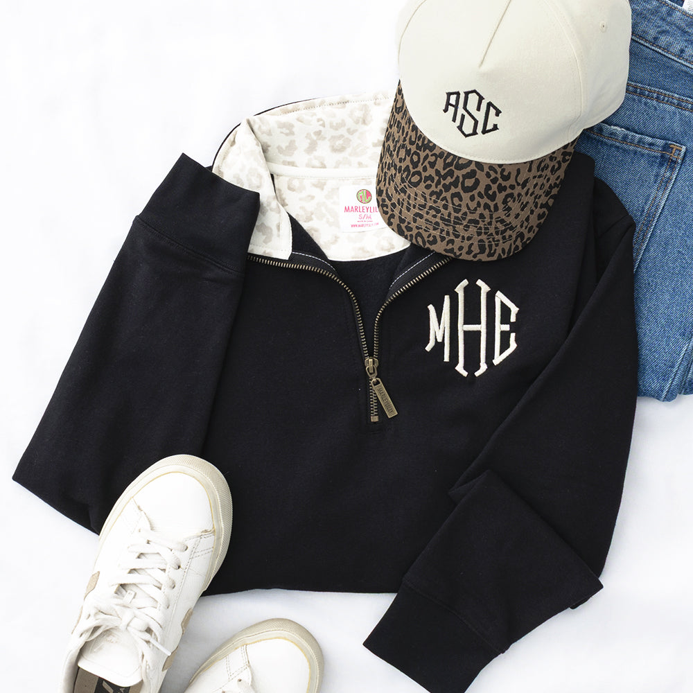 leopard trucker hat with quarter zip sweatshirt