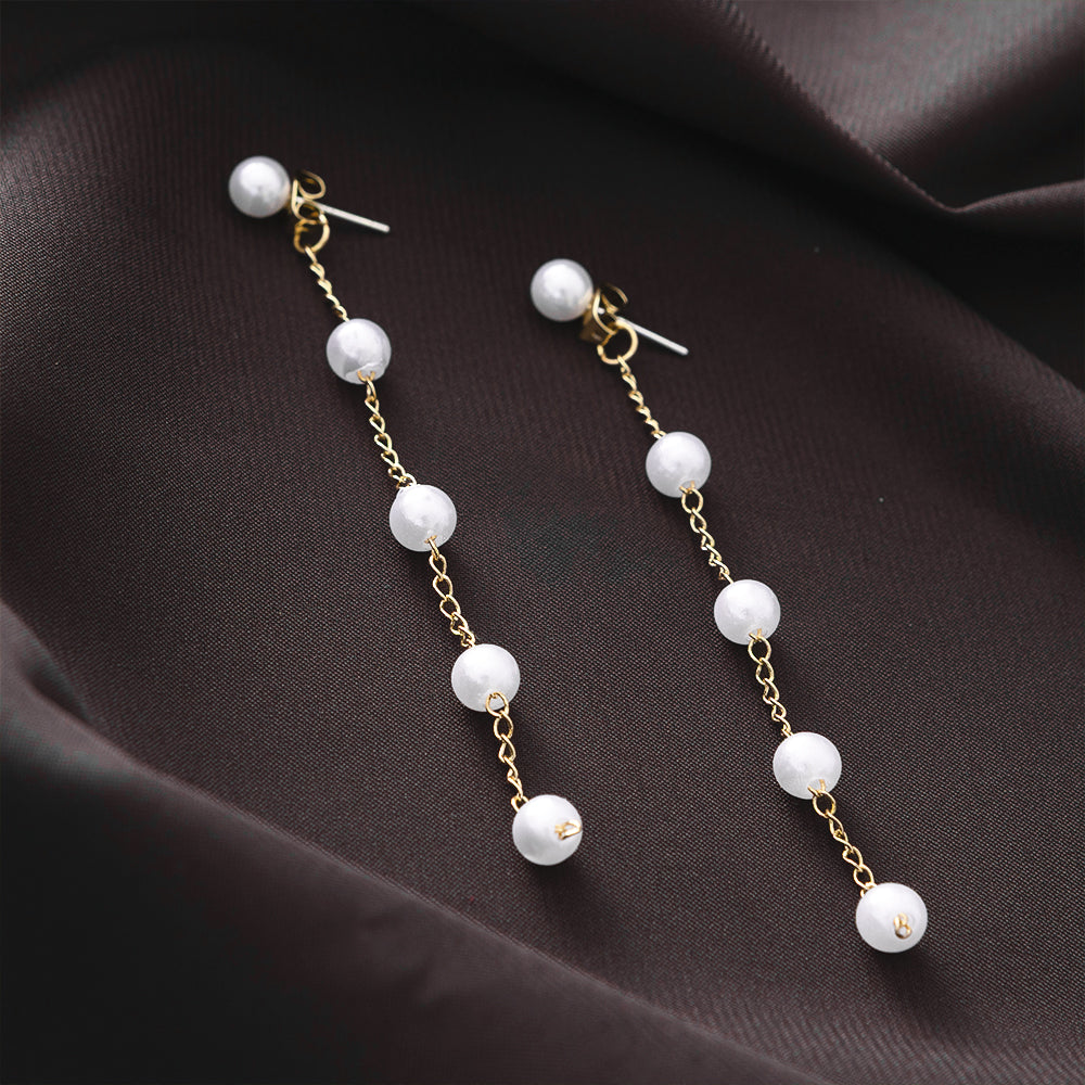 Pearl Duster Earrings on brown satin