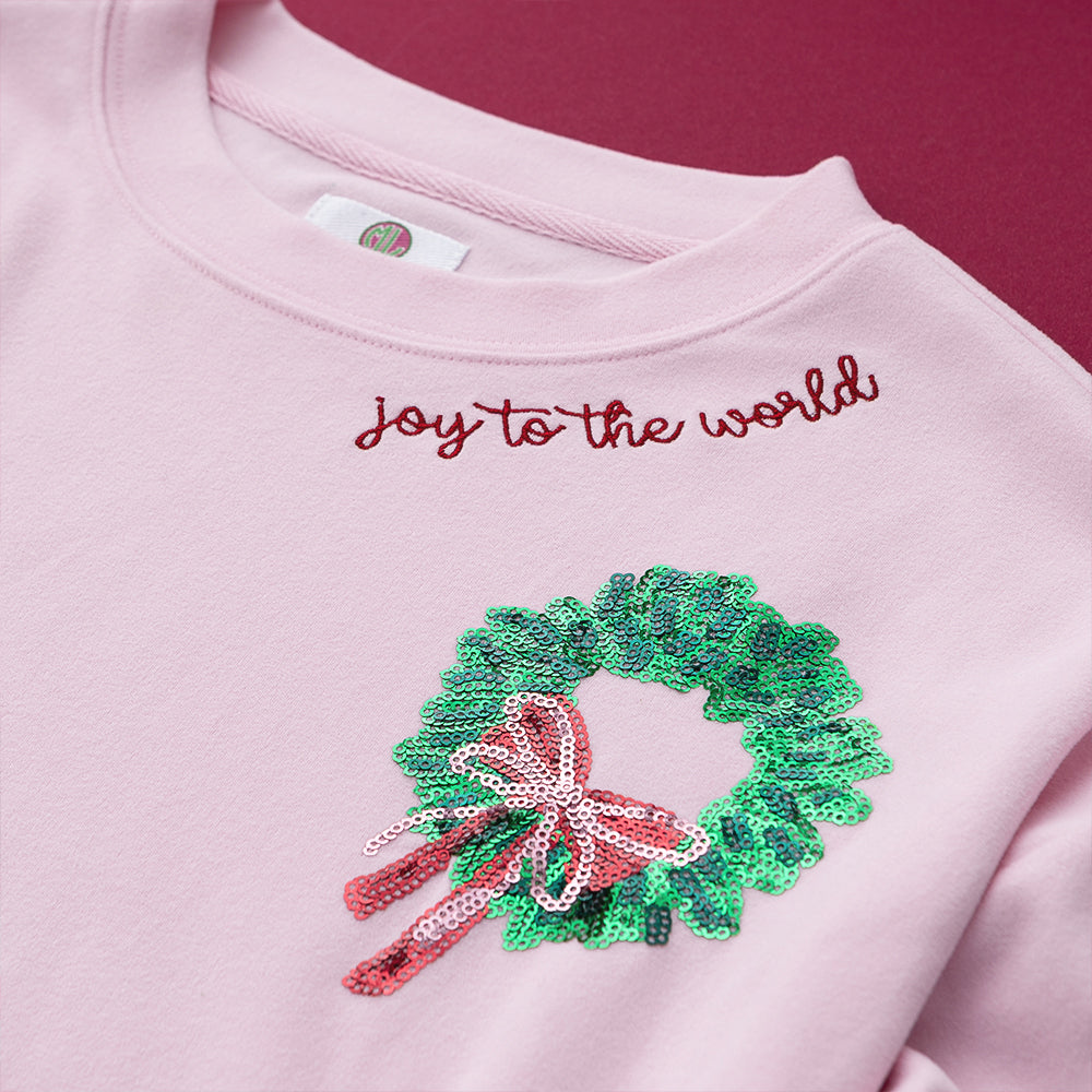 light pink monogrammed sequin wreath sweatshirt detail shot