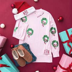 light pink monogrammed sequin wreath sweatshirt flatlay