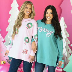 light pink monogrammed sequin wreath sweatshirt on rachel duo teal sweatshirt