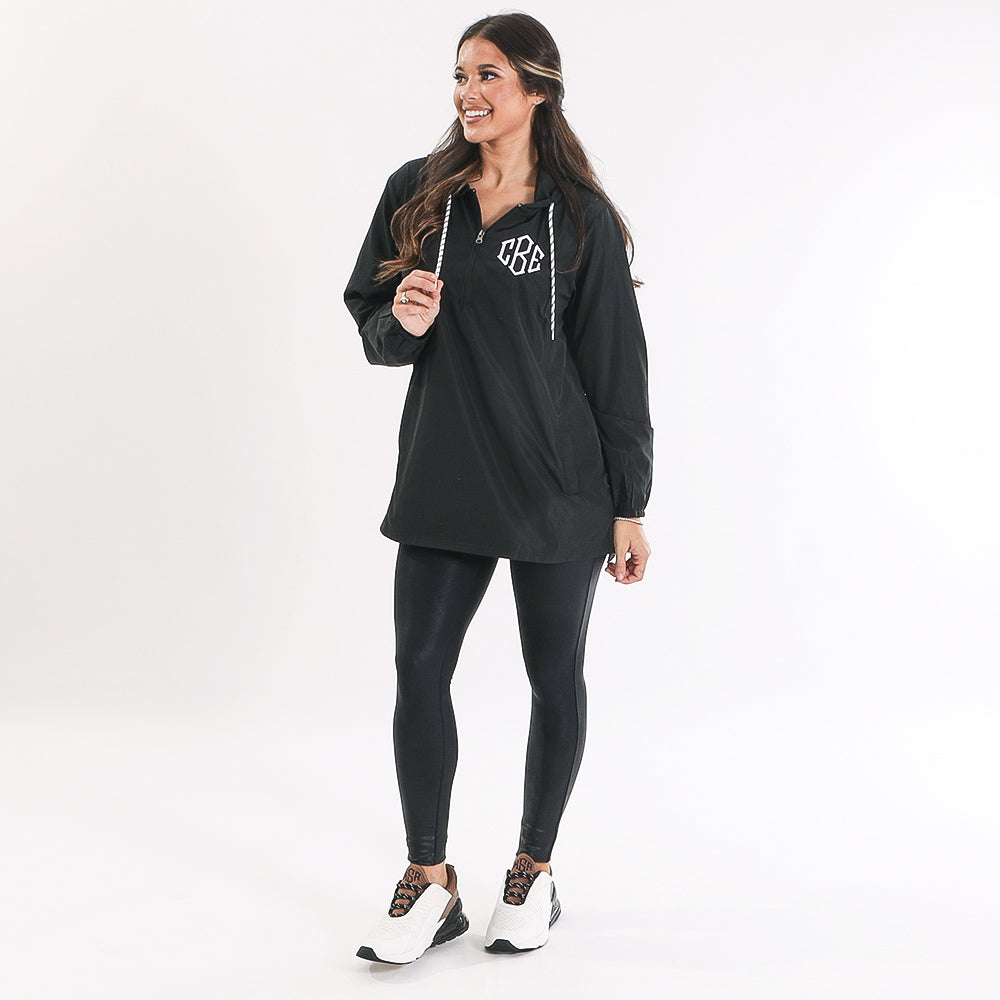 monogrammed black pullover wind breaker with colorblock sneakers