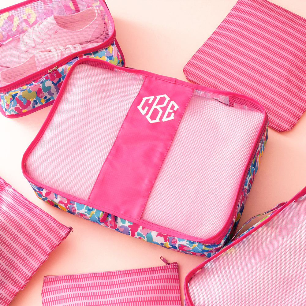 watercolor cheetah packing bag set flatlay
