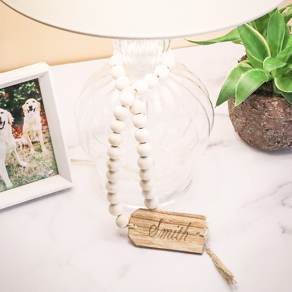 name on personalized wooden tag around lamp