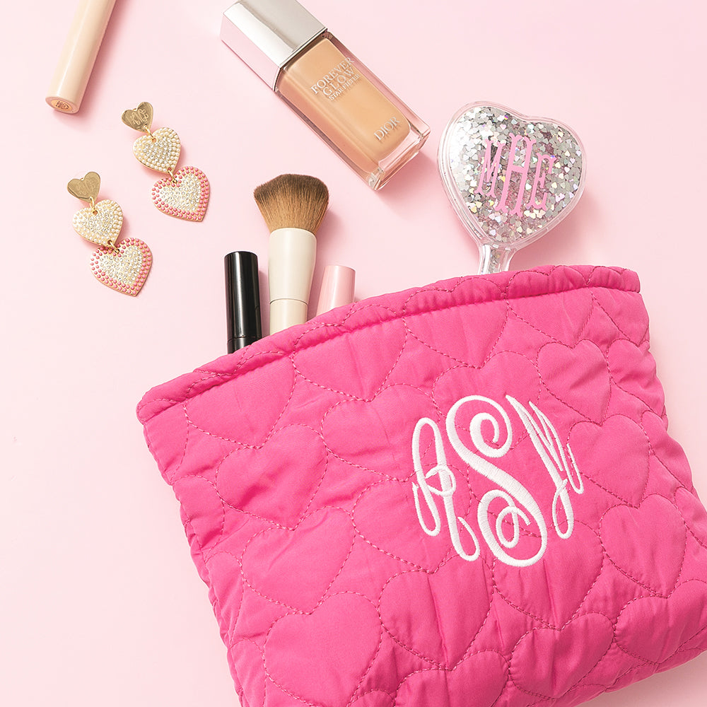 heart cosmetic bag with earrings spillshot.jpg